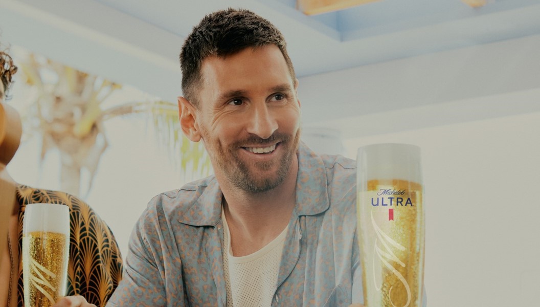 Lionel Messi with a glass of Michelob Ultra